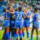 La selection haitienne de football feminine célébrant un but sur la pelouse